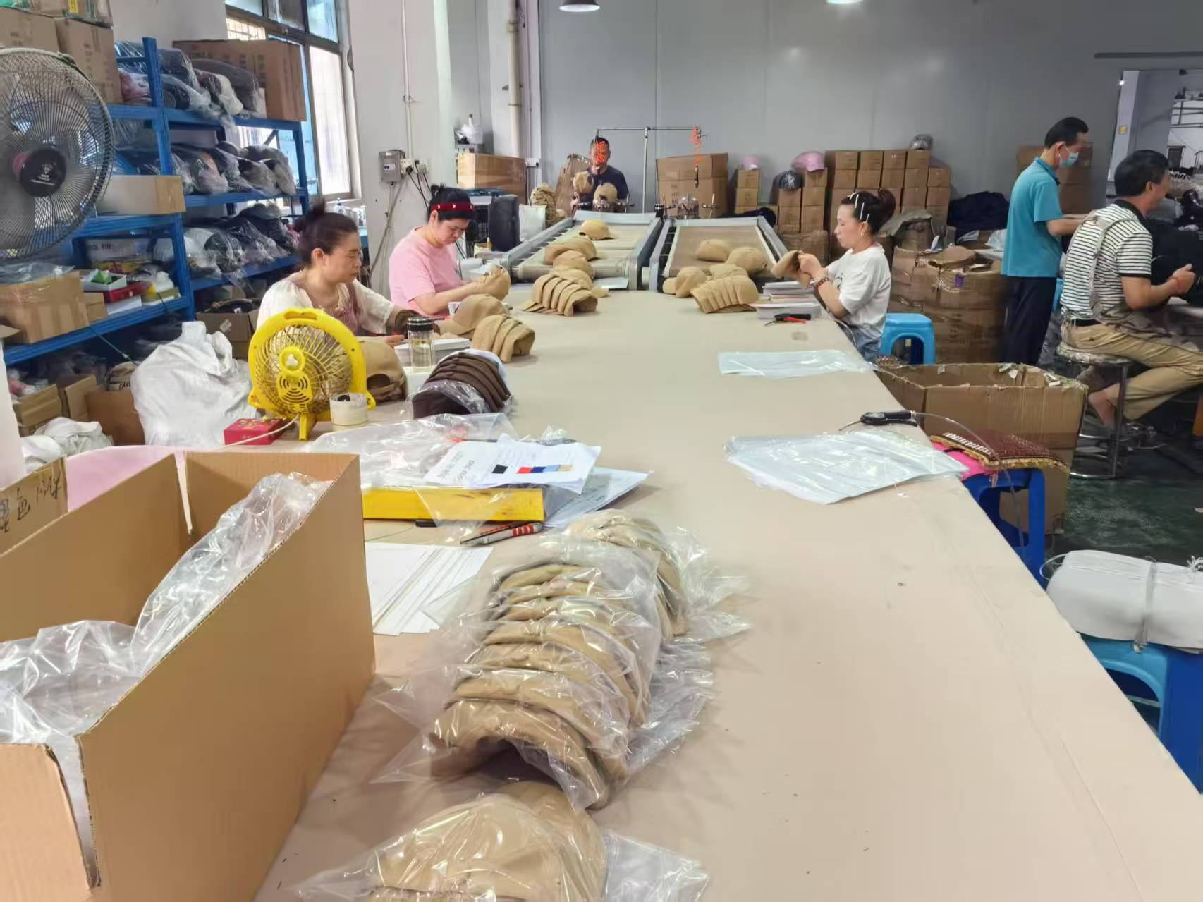 Finished caps being inspected on quality control tables